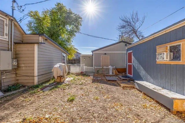 a backyard of a house with seating space