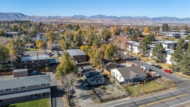 an aerial view of residential houses and city view