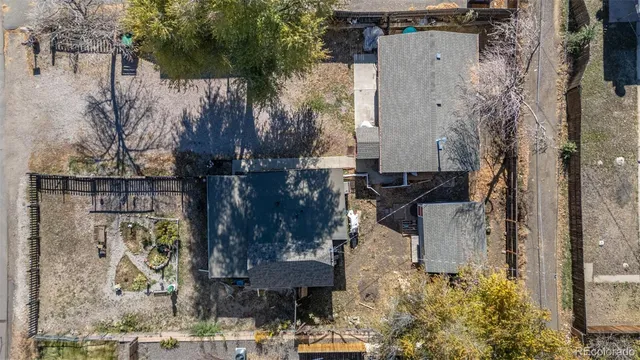 a aerial view of a house with a yard