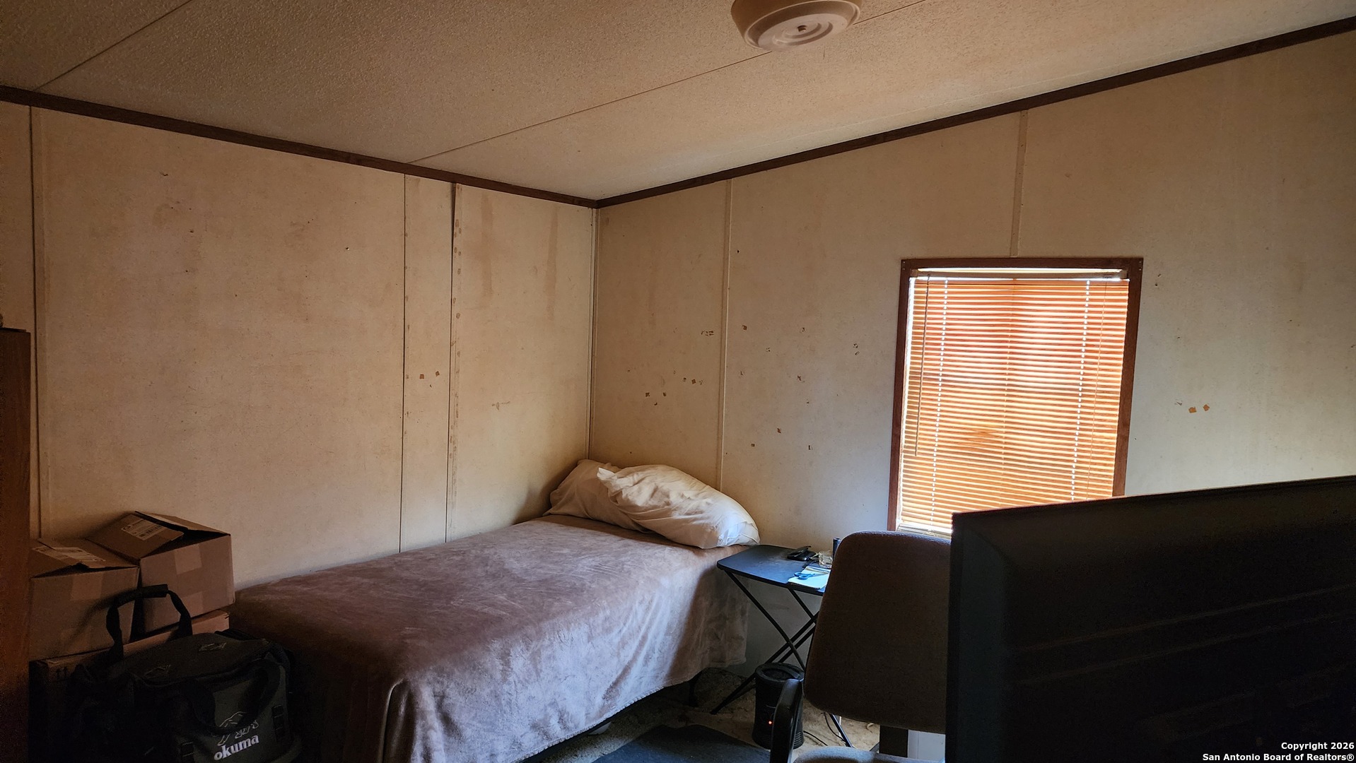 449 Hurst Lane Seguin, TX 78155 - Photo 23 of 28 a bedroom with a bed and a window