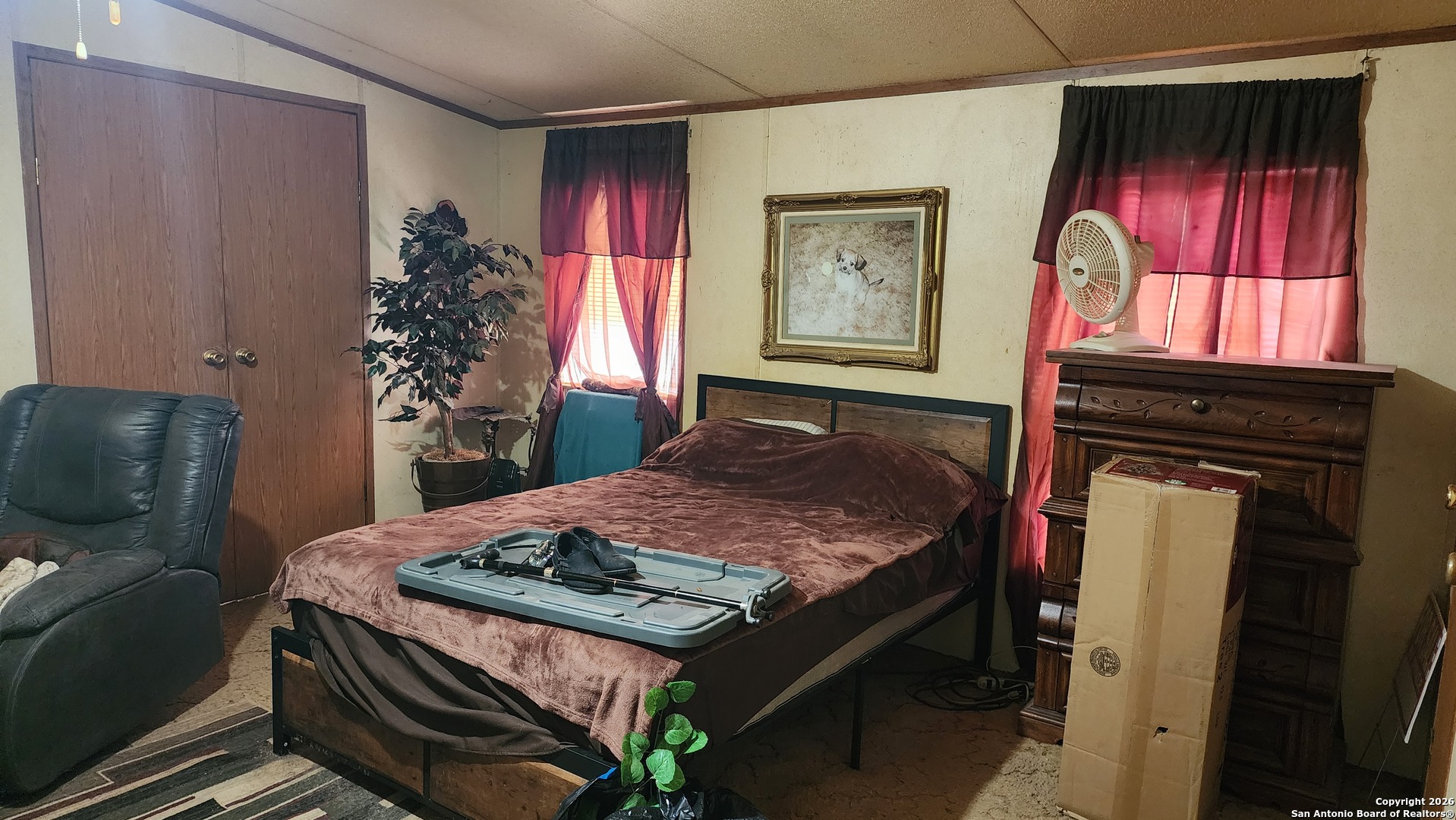 449 Hurst Lane Seguin, TX 78155 - Photo 27 of 28 a bed sitting in a bedroom next to a window