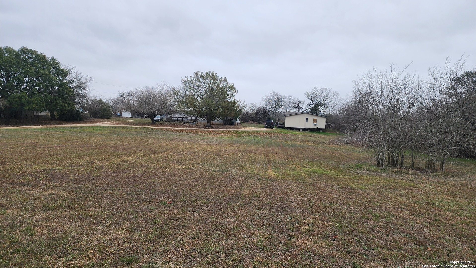 449 Hurst Lane Seguin, TX 78155 - Photo 3 of 28 a view of a field with trees in background