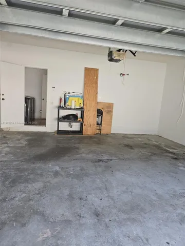 a view of a livingroom with car parked