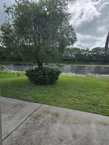 a view of a lake with a big yard