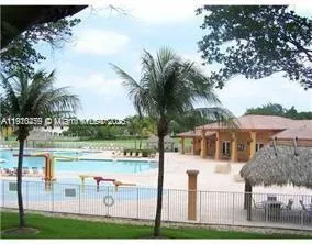 a view of a house with a yard and lake view