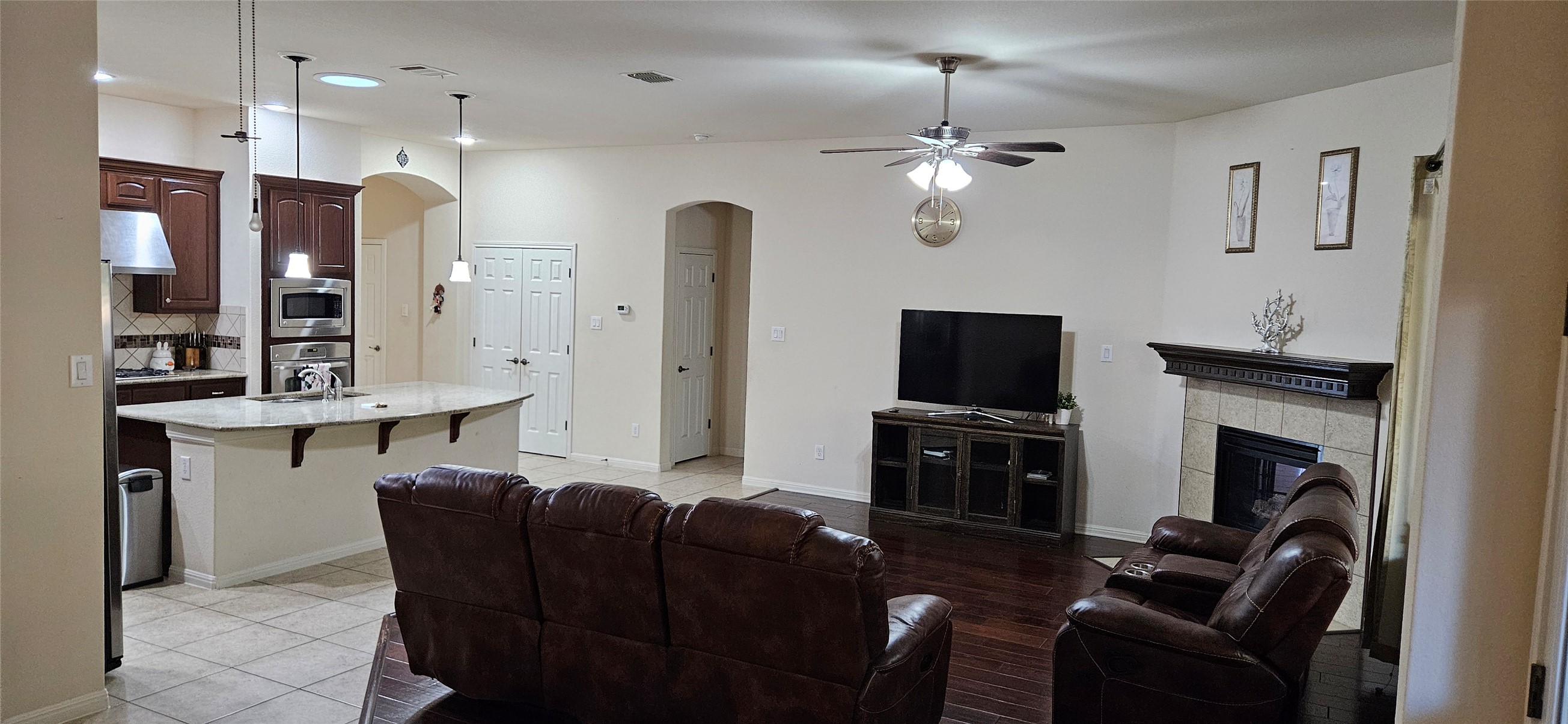 116 Azimuth Drive Austin, TX 78717 - Photo 28 of 33 a living room with furniture a fireplace and a flat screen tv