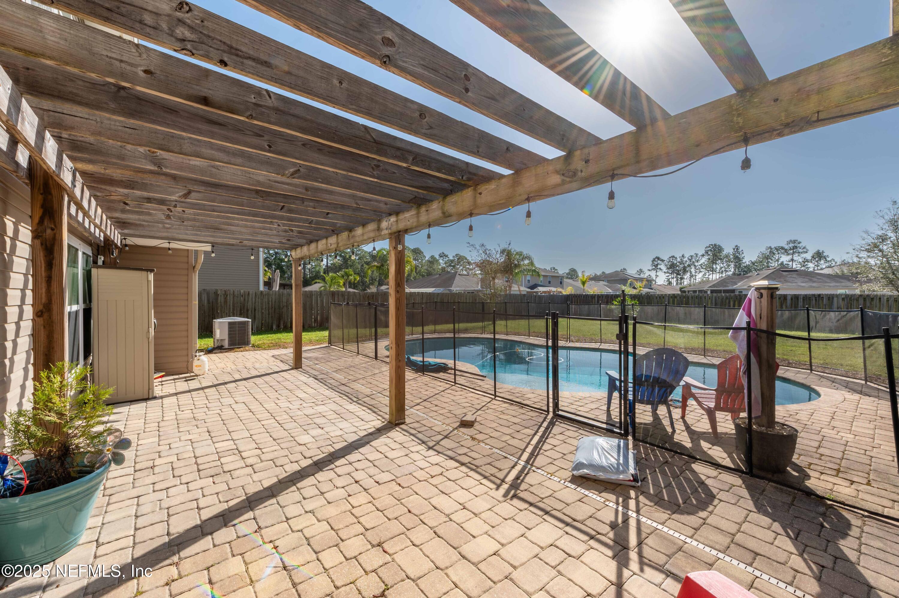 77041 Cobblestone Drive Yulee, FL 32097 - Photo 18 of 23 a building outdoor space with seating space