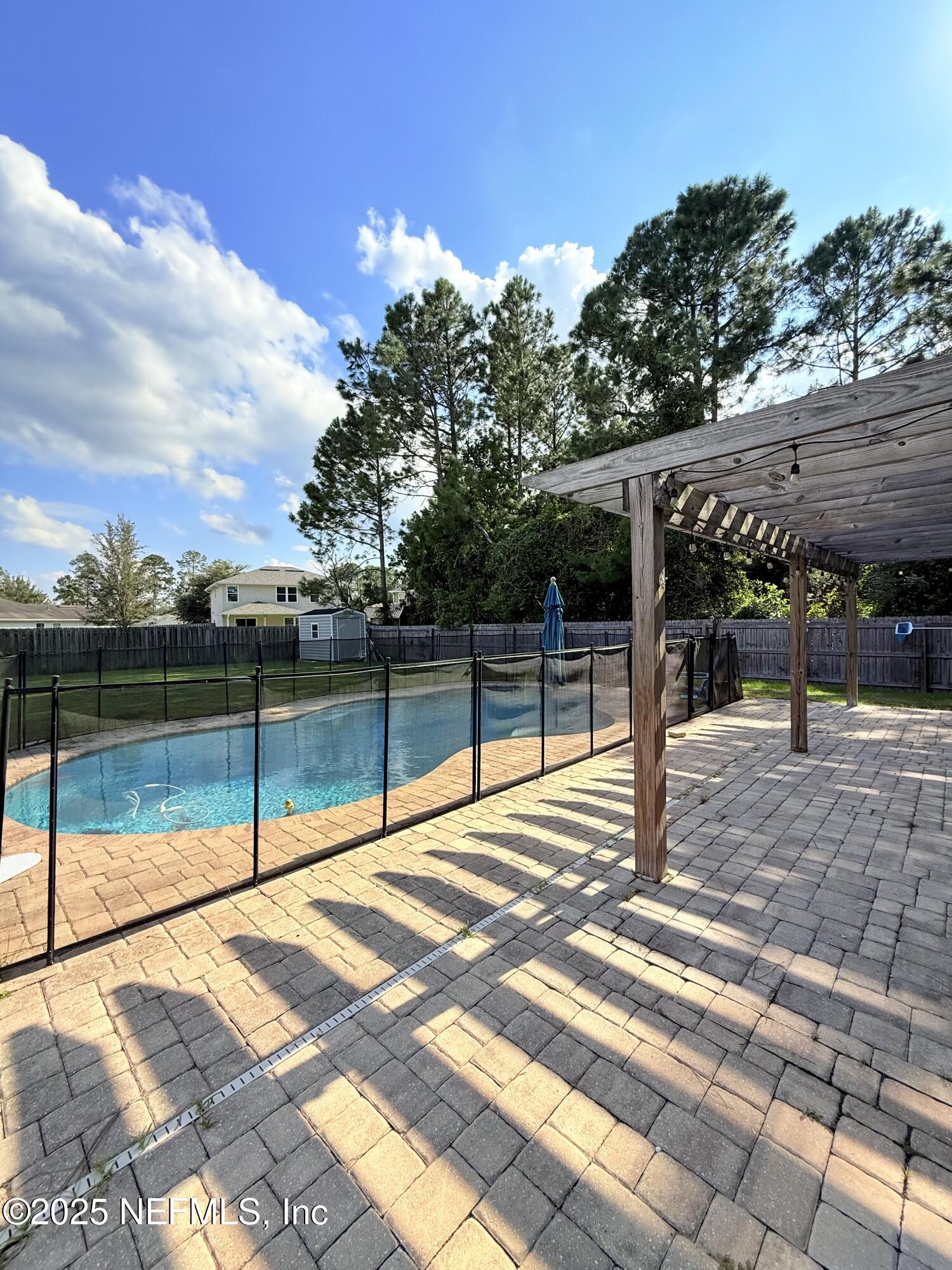 77041 Cobblestone Drive Yulee, FL 32097 - Photo 19 of 23 a view of a backyard