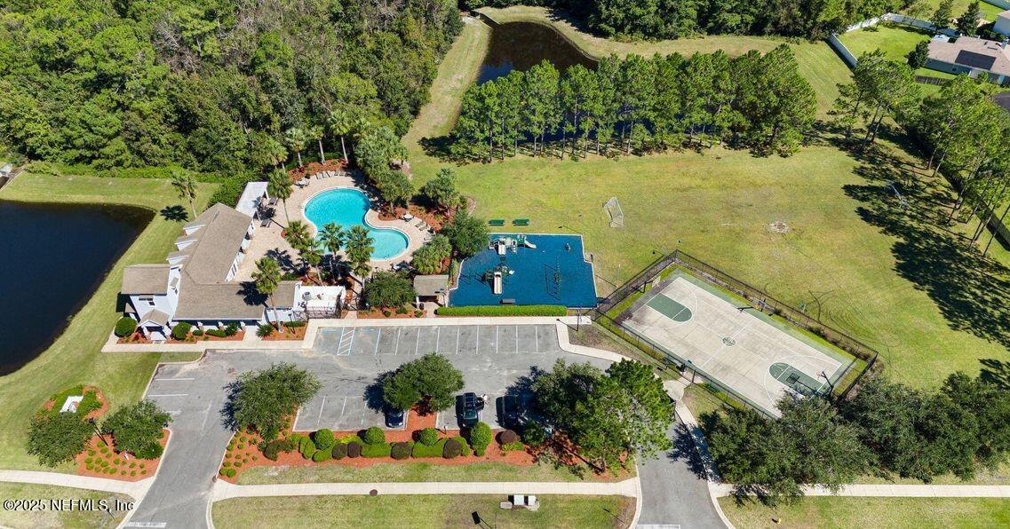 77041 Cobblestone Drive Yulee, FL 32097 - Photo 22 of 23 an aerial view of a house with a garden and swimming pool