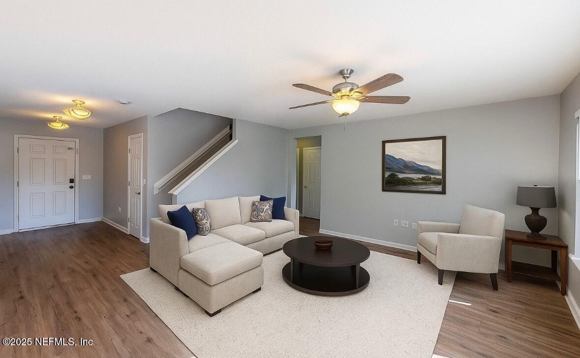 77041 Cobblestone Drive Yulee, FL 32097 - Photo 5 of 23 a living room with furniture and a wooden floor