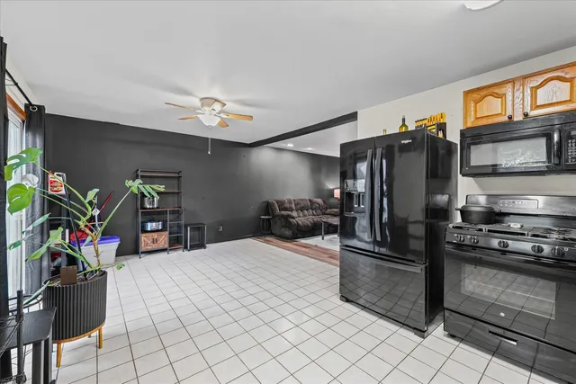 a kitchen with a refrigerator and a sink