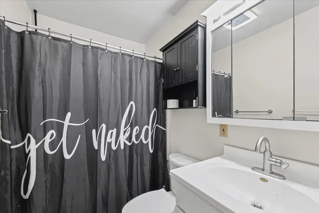 a bathroom with a sink and mirror