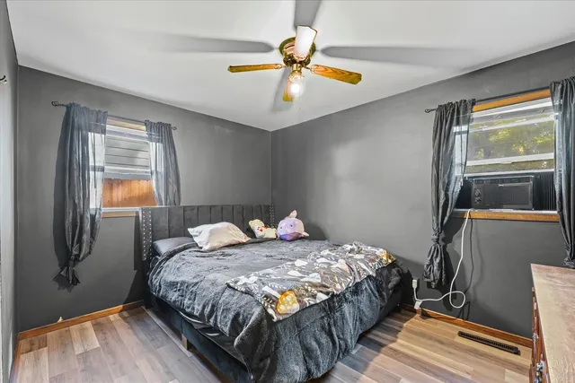 a bedroom with a bed and window