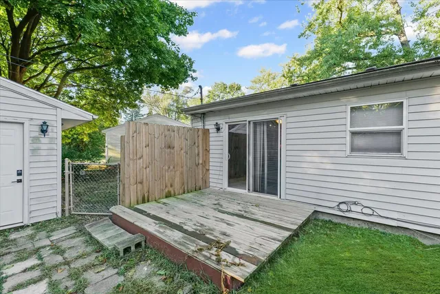 a view of a backyard with a small cabin
