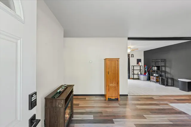 a view of a livingroom with furniture and a ceiling fan