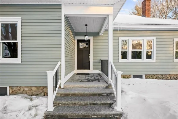 a front view of a house with stairs