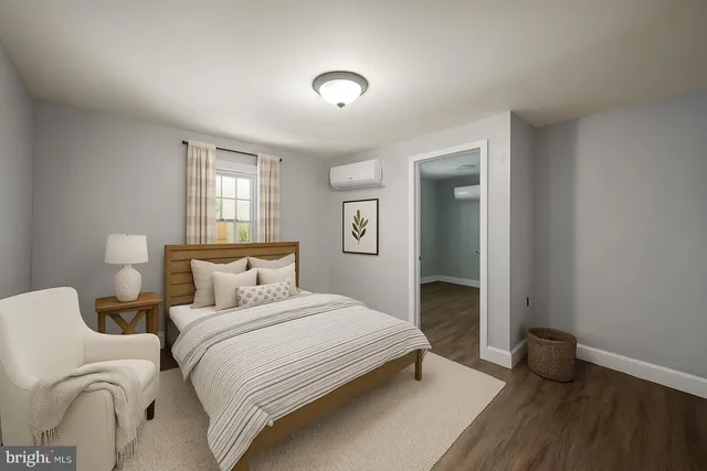 a bedroom with two beds and a window