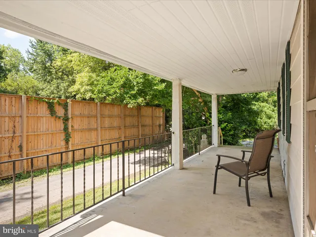 a view of a chairs and table in the balcony