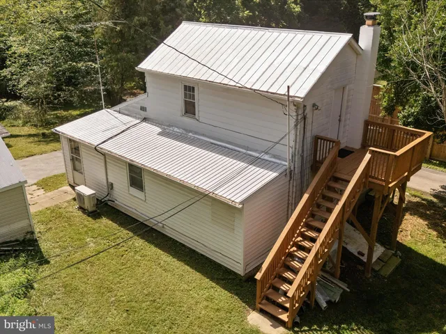 a view of a patio with a table and chairs