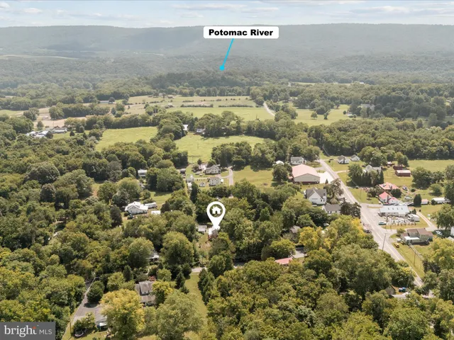 an aerial view of residential building and parking space
