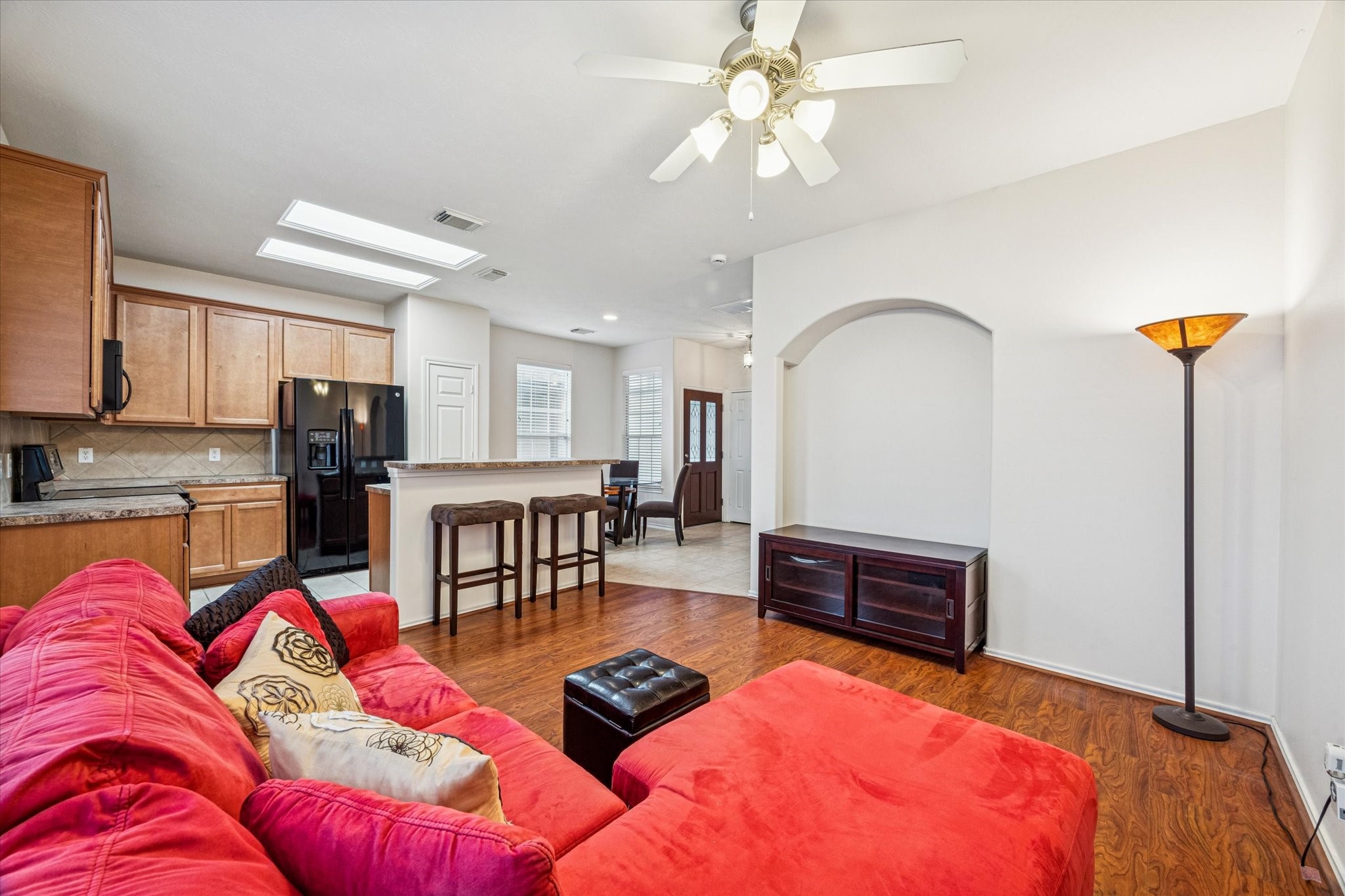 3206 Pearl Bluff Lane Houston, TX 77047 - Photo 9 of 20 a living room with furniture kitchen view and a chandelier