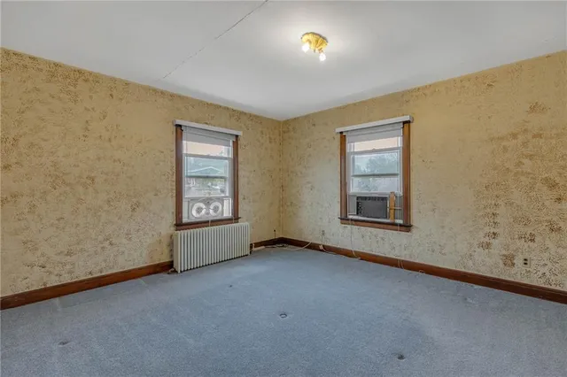 an empty room with closet area