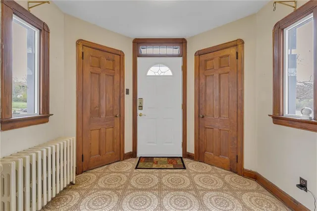 an entryway view with a front door