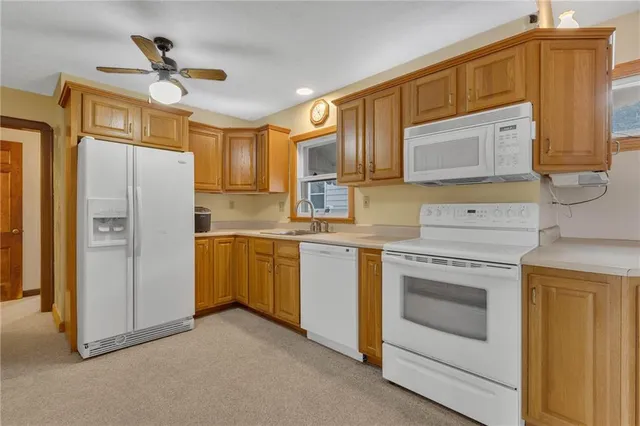 a kitchen with cabinets stainless steel appliances and a counter space