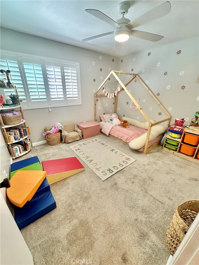 1045 East 3rd Street, Unit 4 Long Beach, CA 90802 - Photo 15 of 20 a bedroom with a bed and a painting on the wall