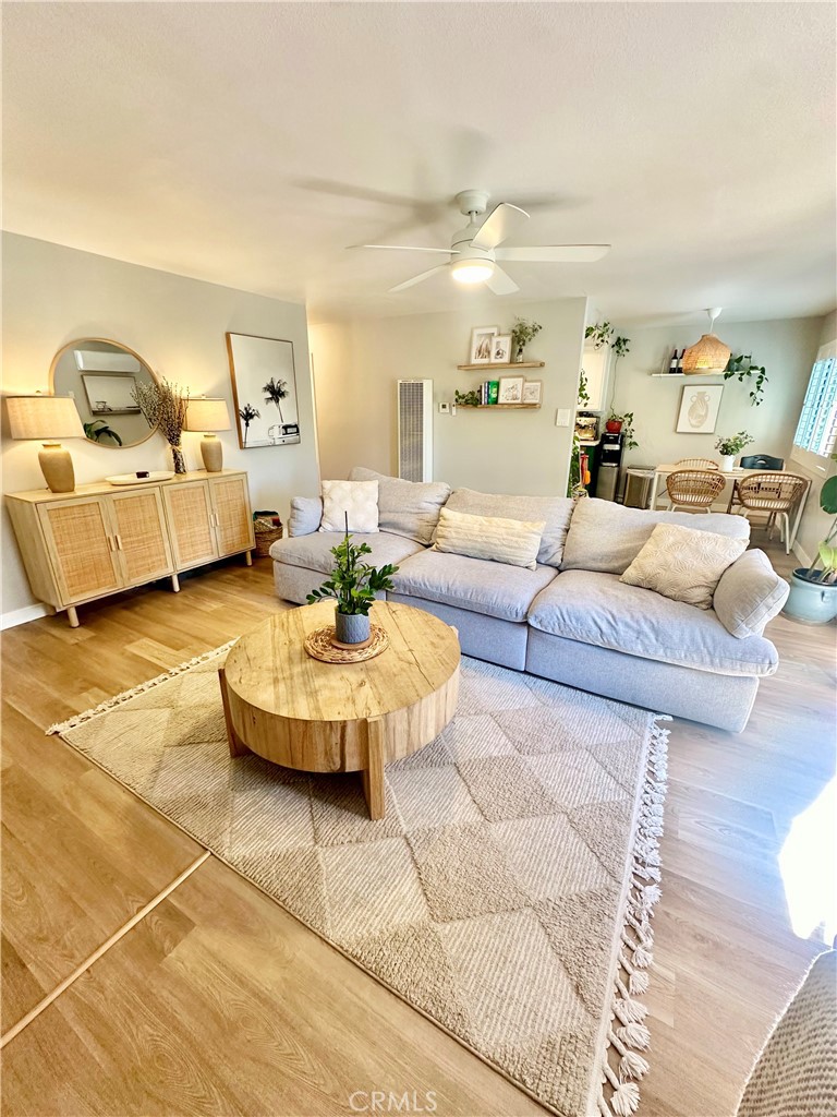 1045 East 3rd Street, Unit 4 Long Beach, CA 90802 - Photo 4 of 20 a living room with furniture and a mirror