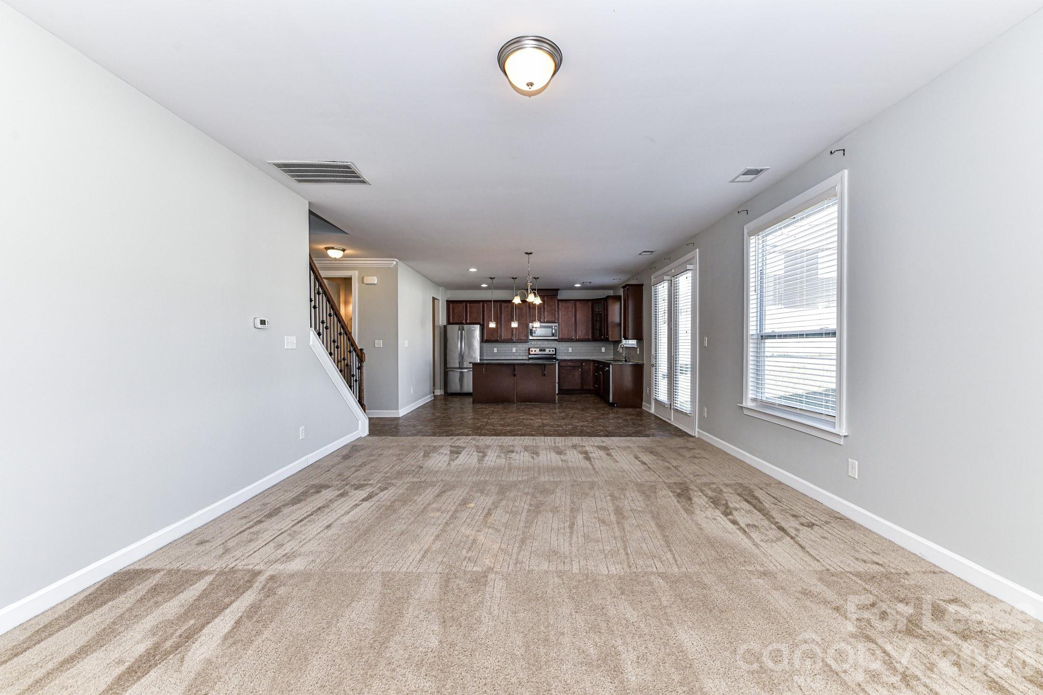 4316 Hubbard Road Charlotte, NC 28269 - Photo 14 of 46 a view of empty room with wooden floor