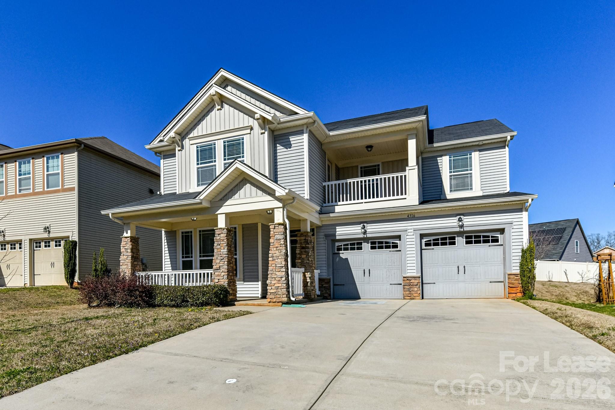 4316 Hubbard Road Charlotte, NC 28269 - Photo 2 of 46 a front view of a house with a yard and garage