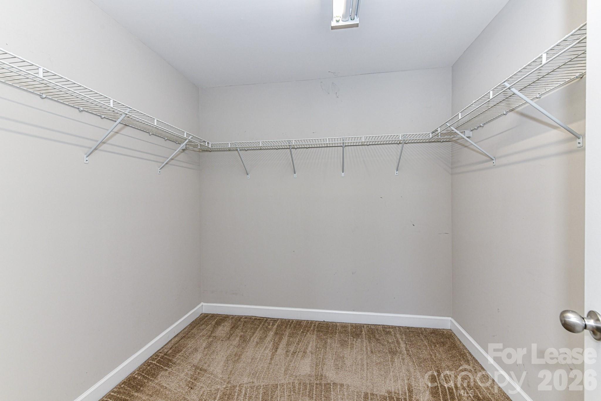 4316 Hubbard Road Charlotte, NC 28269 - Photo 31 of 46 a view of a room with racks on the wall