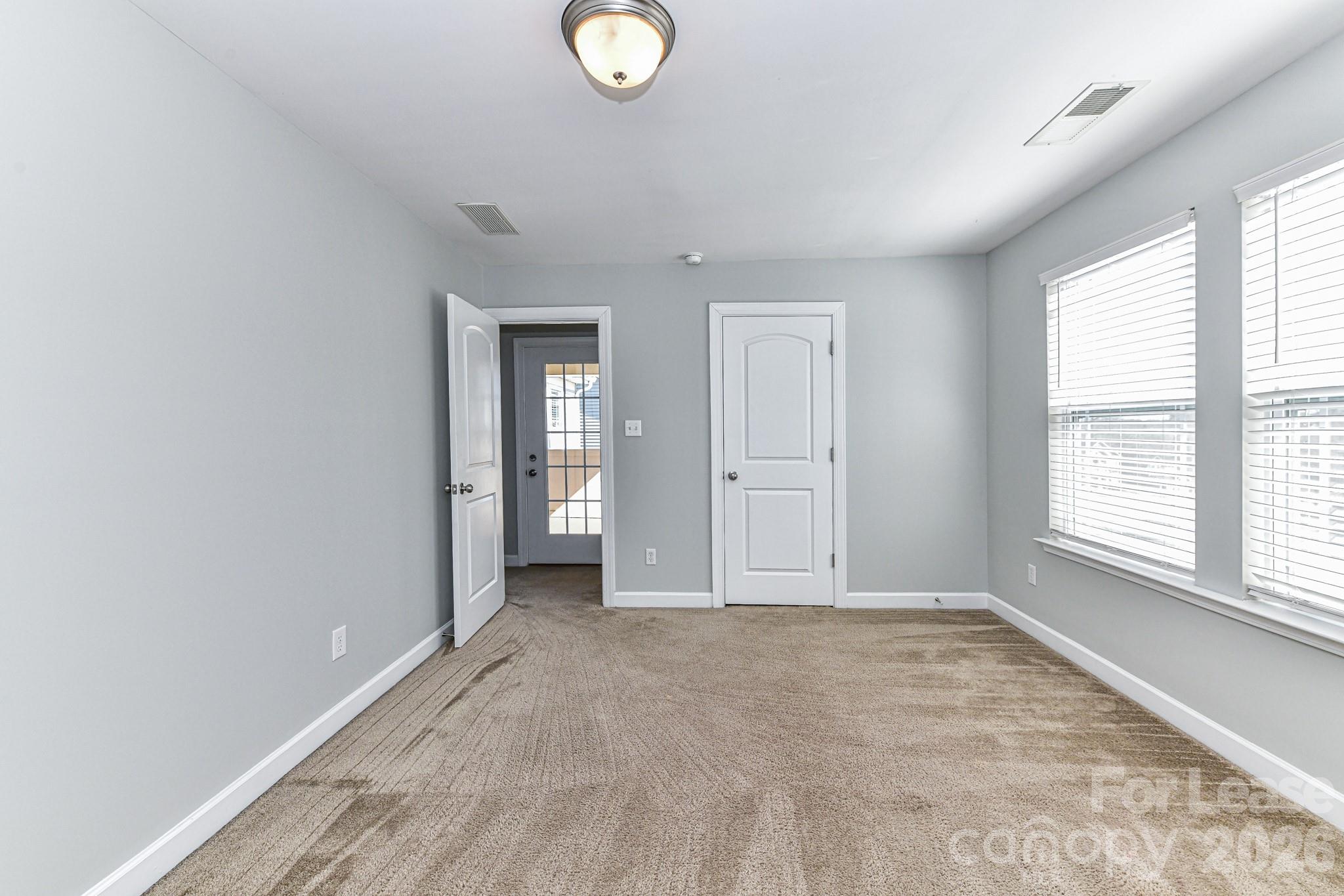 4316 Hubbard Road Charlotte, NC 28269 - Photo 38 of 46 an empty room with windows and closet