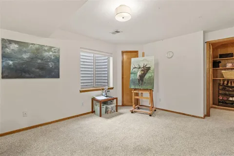 a view of a livingroom with furniture and front door