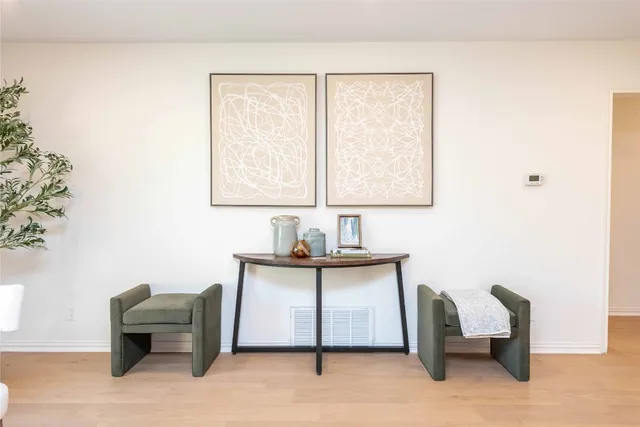 a view of a livingroom with furniture and a window