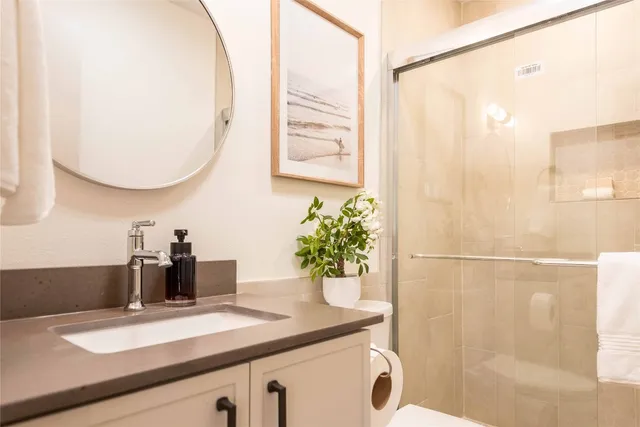 a kitchen with a sink and a refrigerator