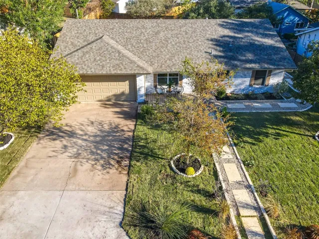 a aerial view of a house with swimming pool