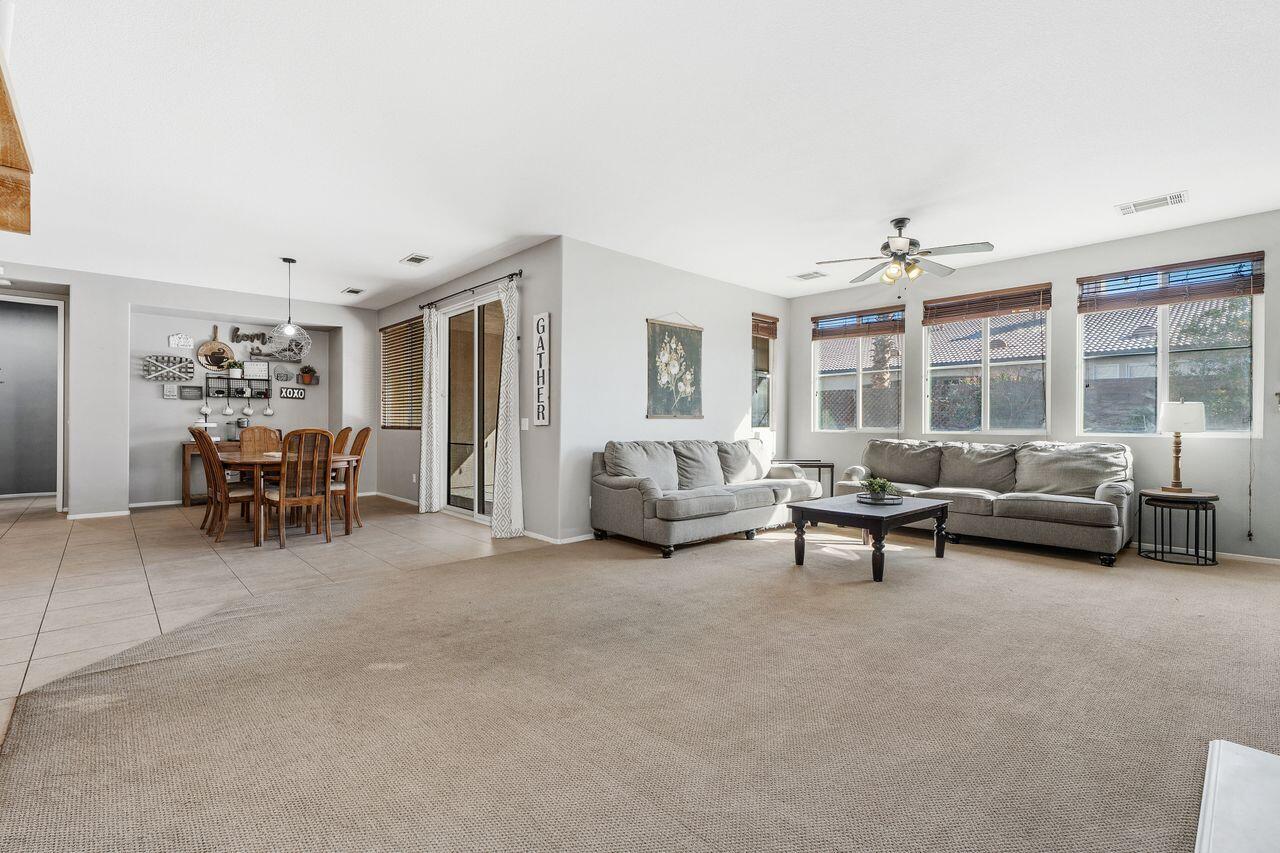 42724 Tango Court Indio, CA 92203 - Photo 13 of 27 a living room with furniture and a large window