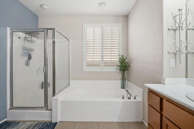 a bathroom with a bathtub and a shower