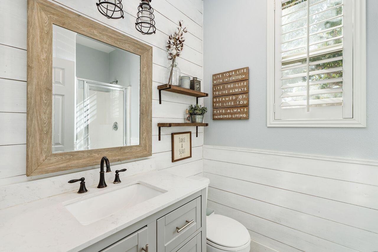 42724 Tango Court Indio, CA 92203 - Photo 20 of 27 a bathroom with a sink a toilet and a mirror