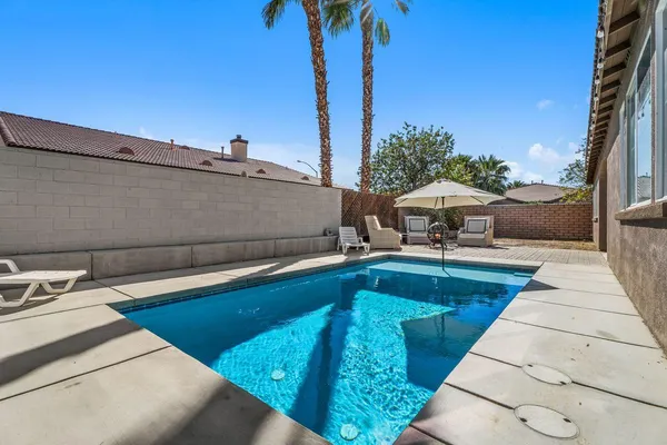 a view of a patio with swimming pool