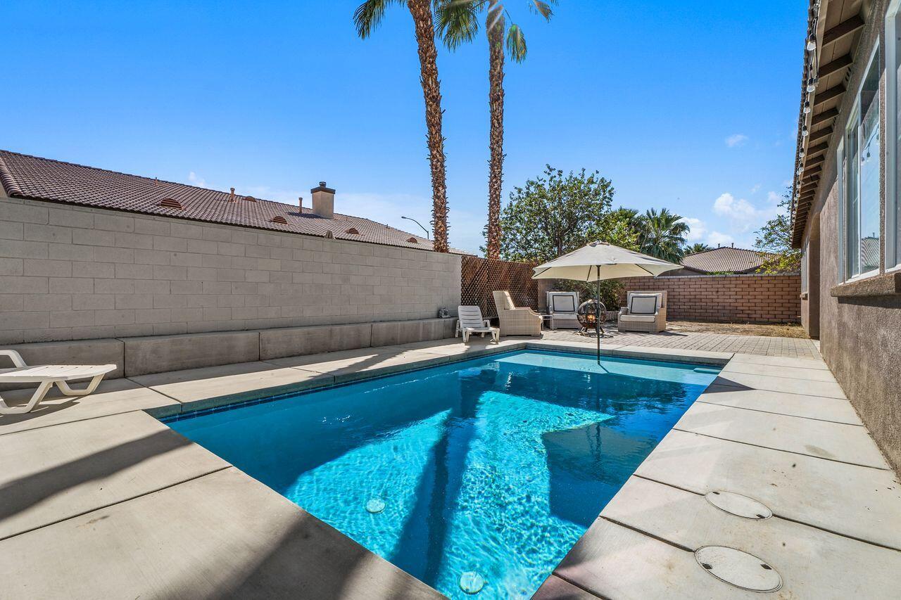 42724 Tango Court Indio, CA 92203 - Photo 24 of 27 a view of a patio with swimming pool