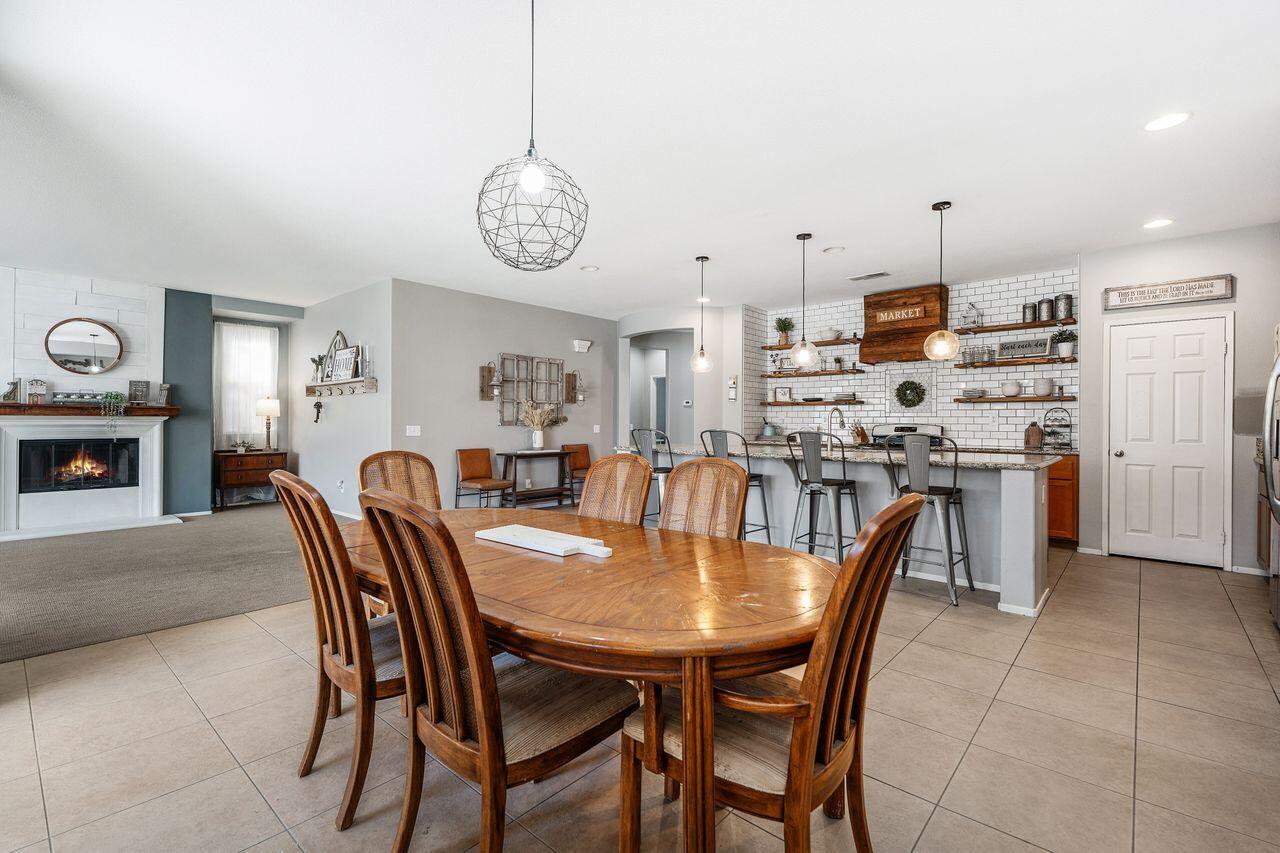 42724 Tango Court Indio, CA 92203 - Photo 10 of 27 a view of a dining room with furniture
