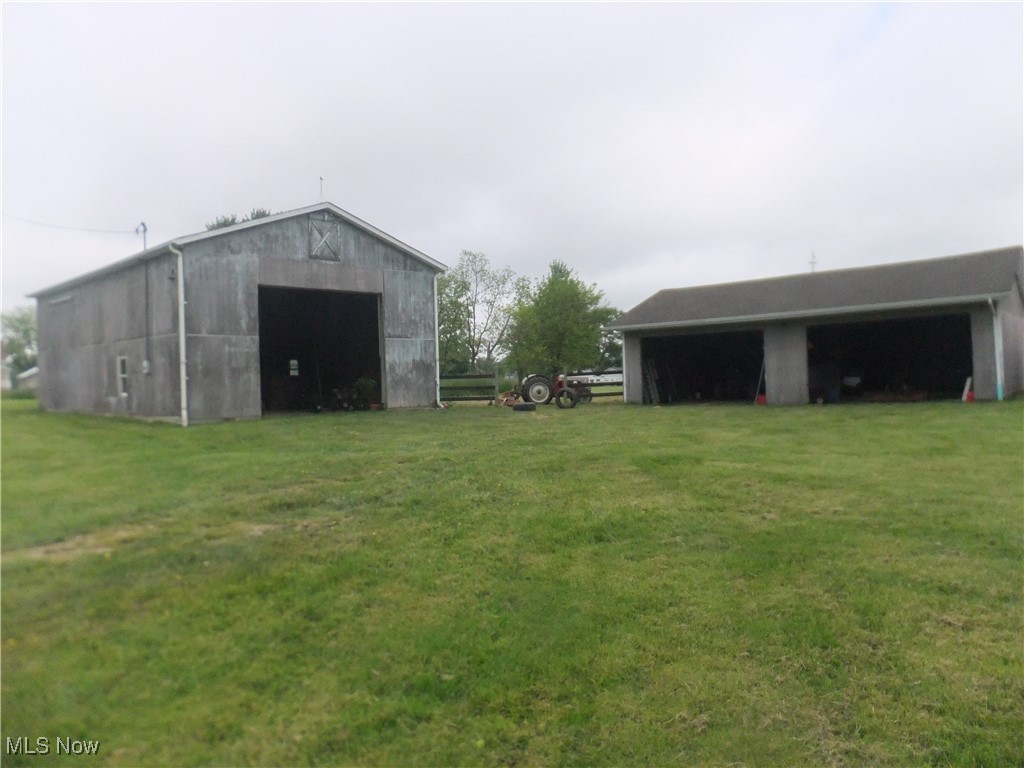 10677 Moss Road Lodi, OH 44254 - Photo 19 of 34 View of pole building with a yard