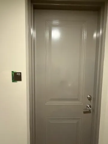 a bathroom with a glass shower door