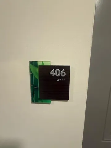 a view of an empty room and wooden floor