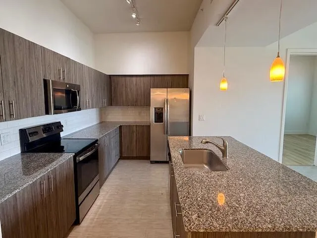 a bathroom with a window and a shower