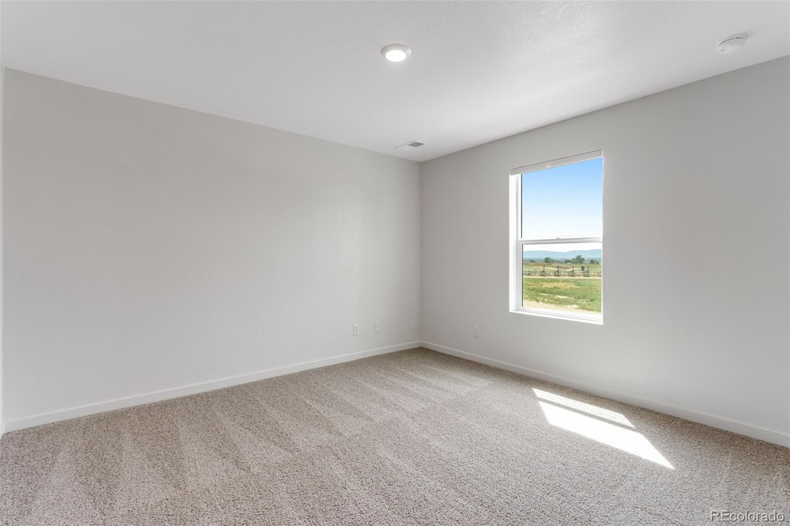 2360 Merlot Street Fort Lupton, CO 80621 - Photo 16 of 21 an empty room with a window