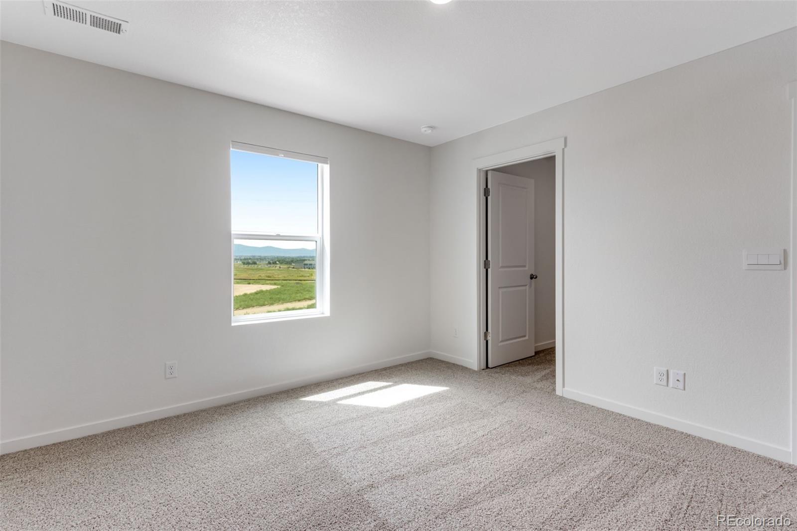 2360 Merlot Street Fort Lupton, CO 80621 - Photo 17 of 21 an empty room with a window